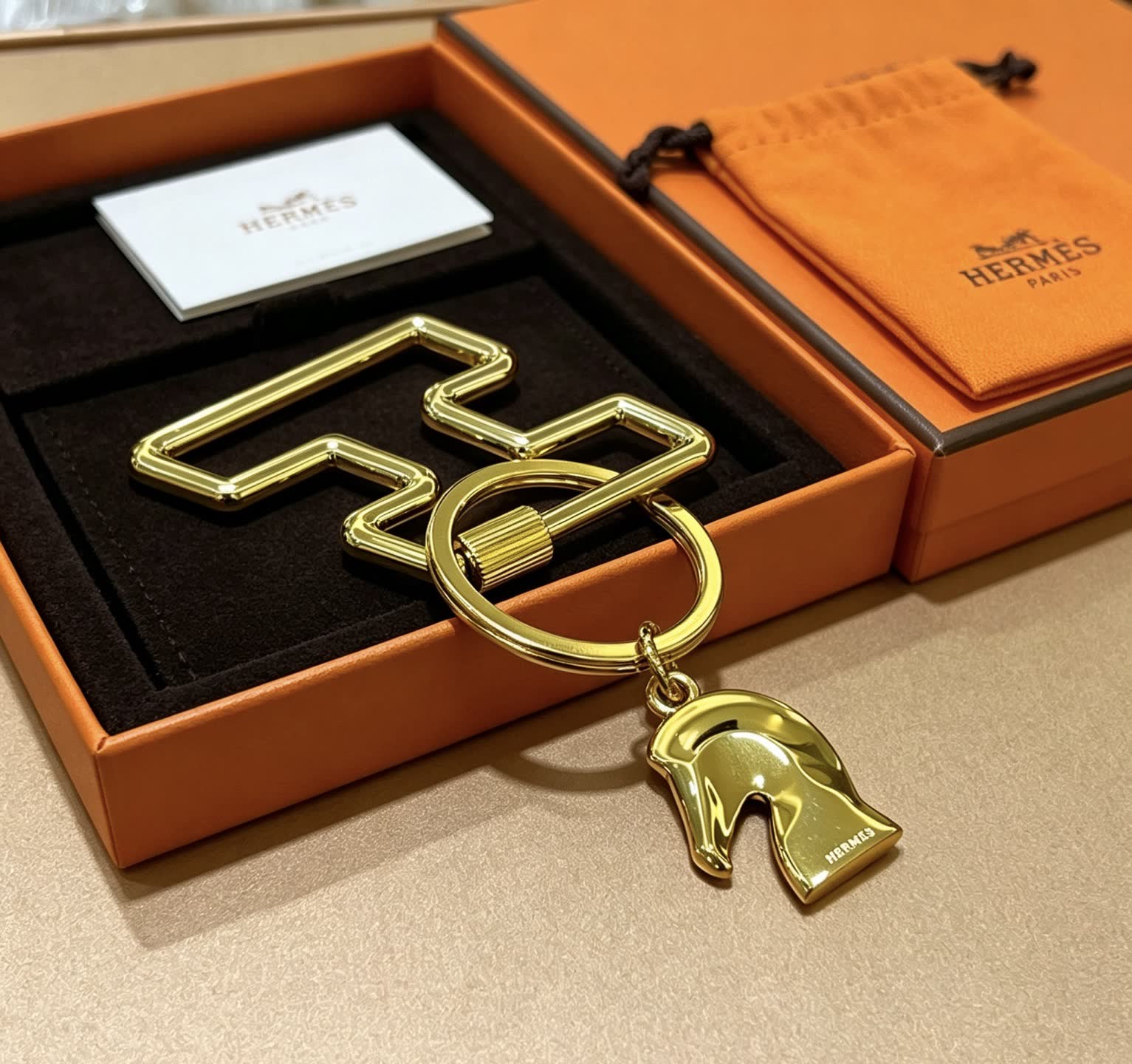 Hermès Gold-Tone Leather Keychain with Horse Head Charm