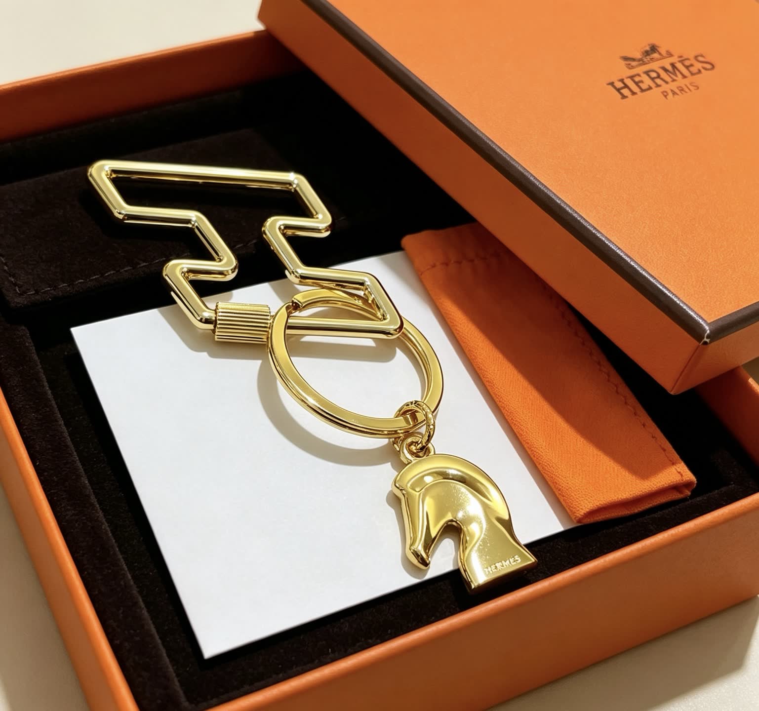 Hermès Gold-Tone Leather Keychain with Horse Head Charm