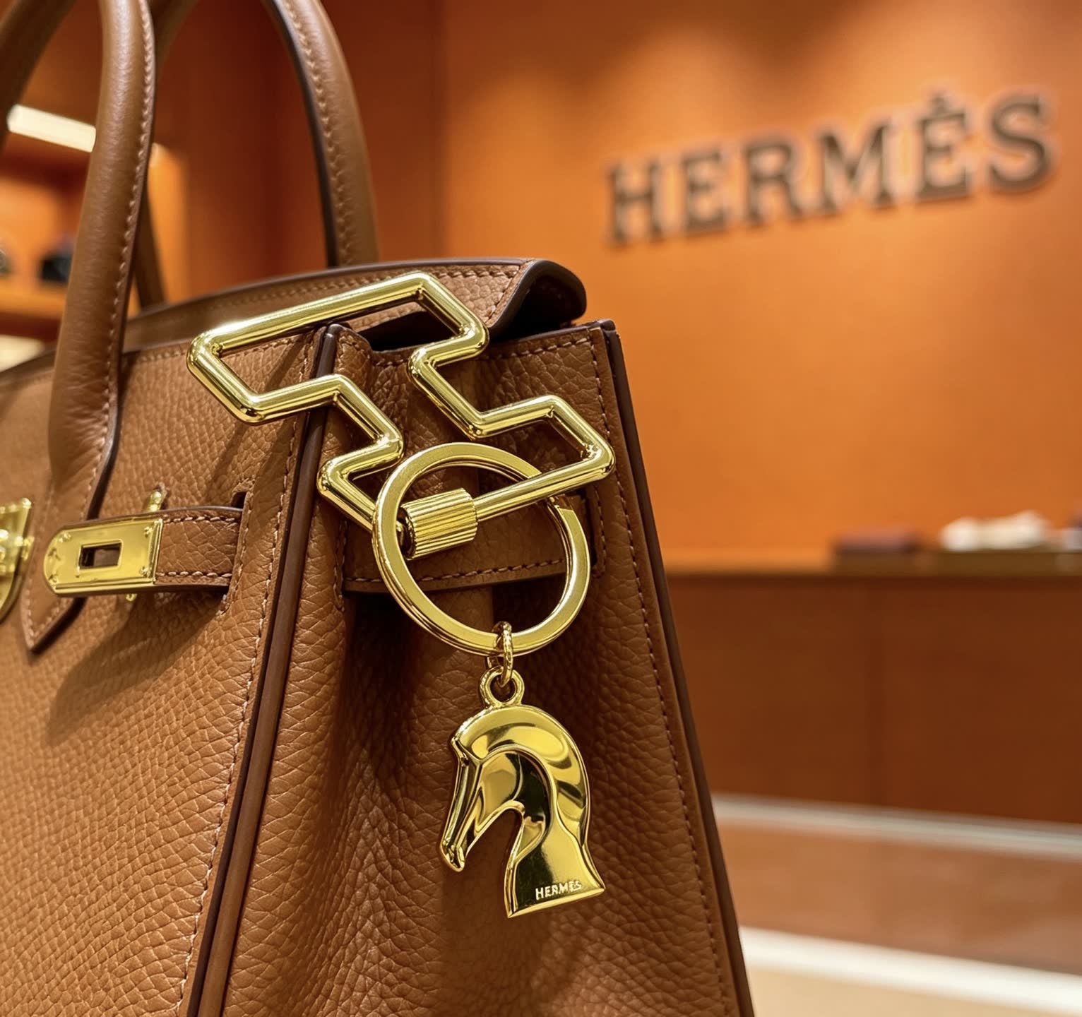 Hermès Gold-Tone Leather Keychain with Horse Head Charm