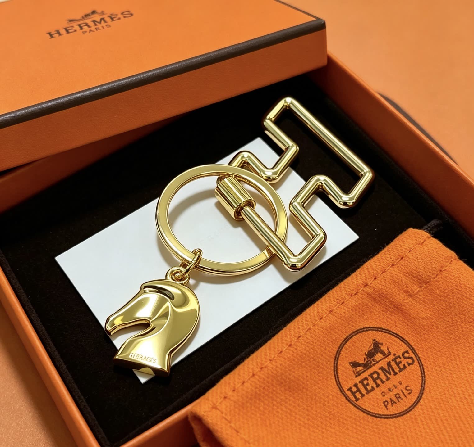 Hermès Gold-Tone Leather Keychain with Horse Head Charm
