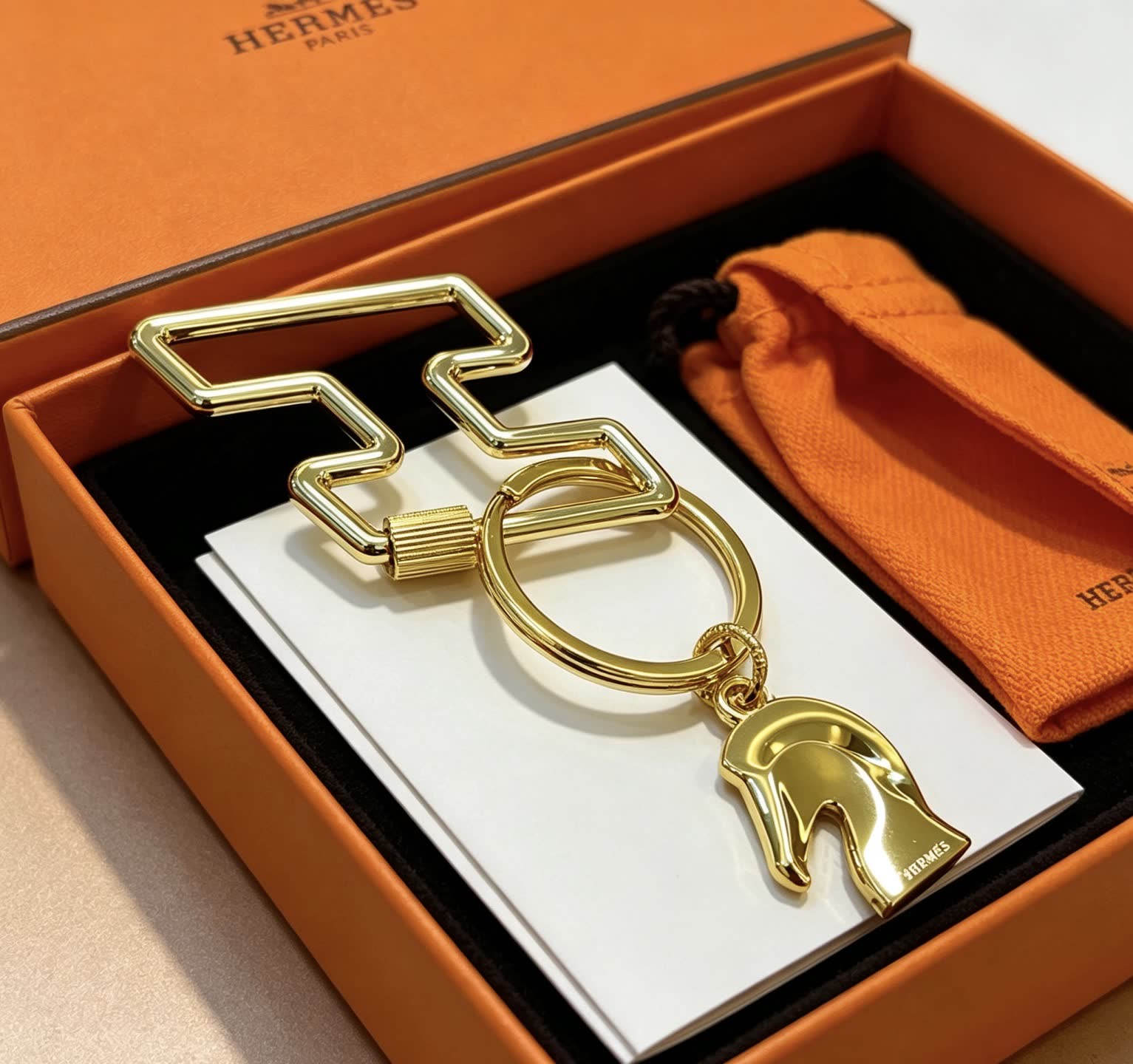 Hermès Gold-Tone Leather Keychain with Horse Head Charm