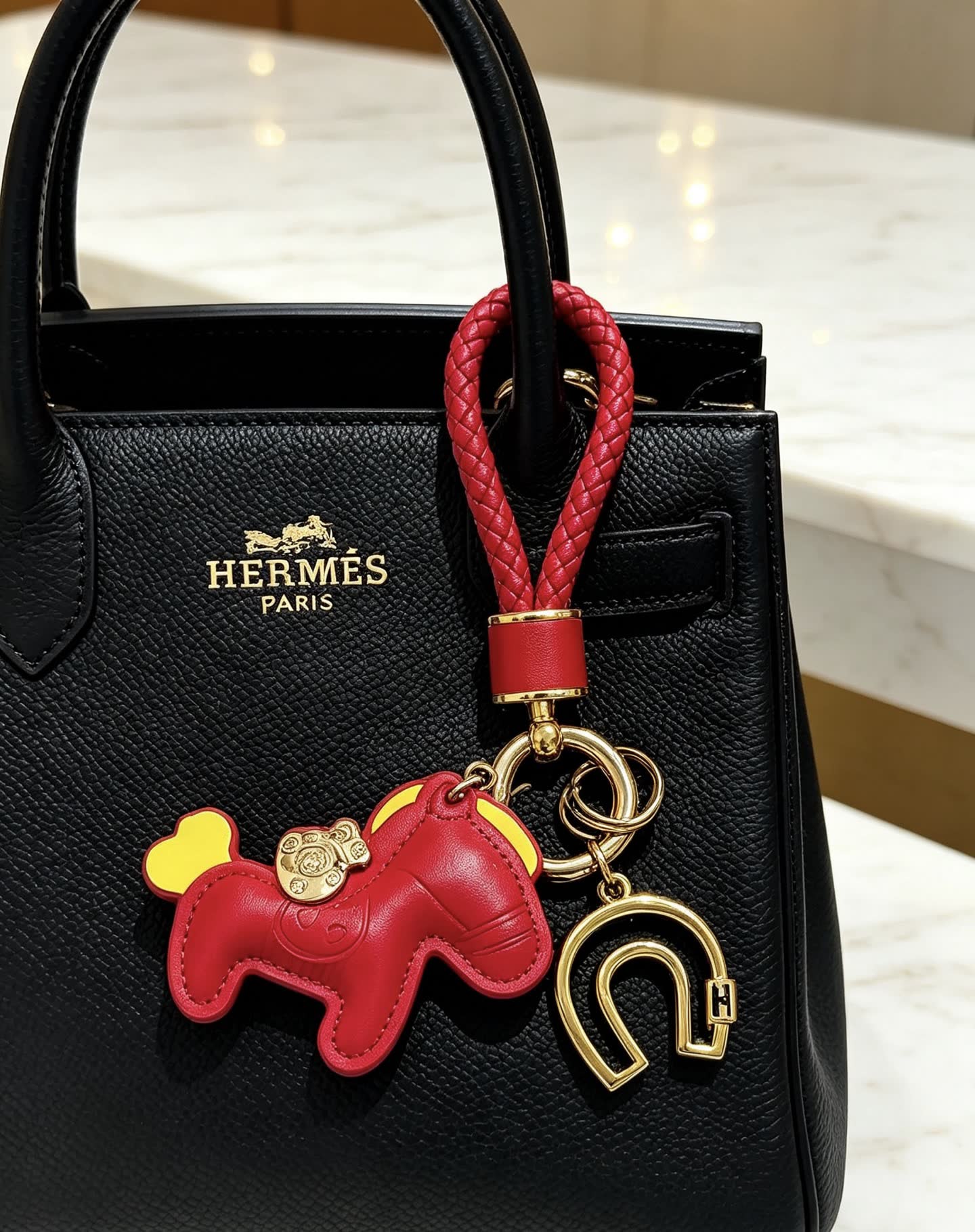 Hermes Hermès Paris Leather Keychain with Red and Gold Horseshoe Charm Hermes Hermès Paris Leather Keychain with Red and Gold Horseshoe Charm