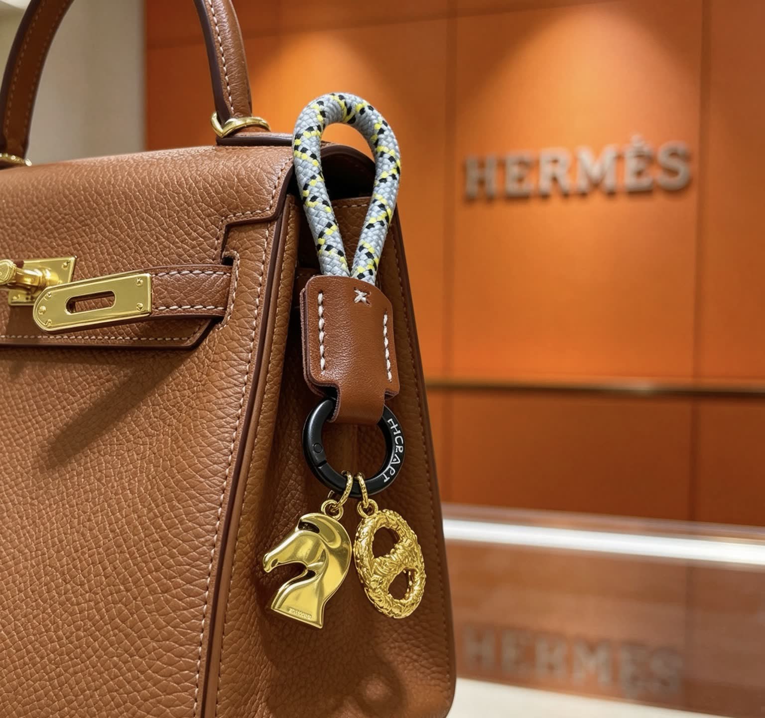 Hermes Hermès Kelly Bag Charm with Gold Horse and intertwined H